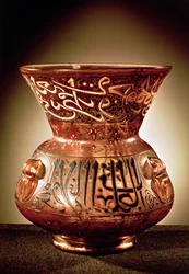Mosque lamp with enamelled decoration inscribed with three quotations from the Koran and dedicated to Beybars II, early 14th century
